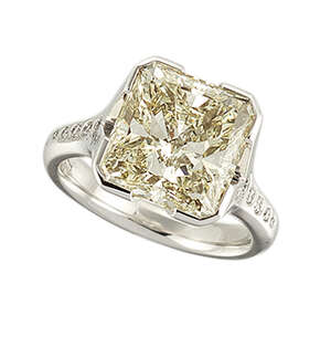 A diamond single stone ring, the radiant-cut diamond, weighing 5.02 carats, in broad four claw...