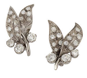 
	
		A pair of diamond earrings, of bud and twin leaf design set throughout with...