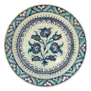 
	
		A large Iznik pottery dish with three large blue flowers, Ottoman Turkey, late 16th-early...