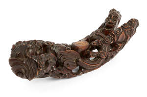 
	
		A Chinese carved wood stand, late 19th century, profusely carved with dragons amidst...
