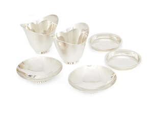 
	
		Two Tiffany & Co. finger bowls, the plain dipped body raised upon a circular foot, 7cm...