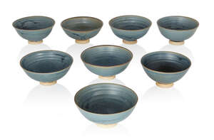 
	
		Designer unknown, 
		 
		Set of eight Studio pottery footed side bowls, late 20th...