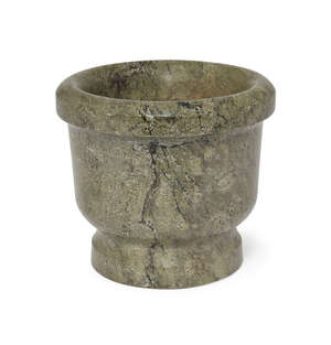 
	
		A green marble mortar, 19th century, of typical form with waisted base, 17cm high

	

