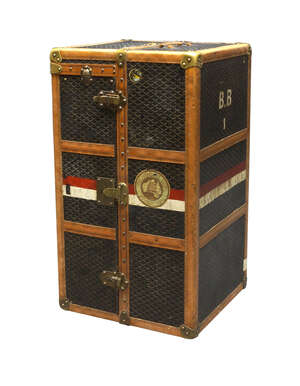 
	
		A Goyard steamer trunk, c.1900, leather bound chevron fabric with brass fittings, one...
