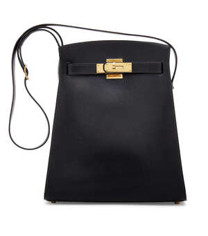 
	
		Hermes: an Hermes black leather Kelly Sport MM, 1993, with black leather adjustable...