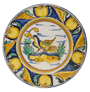 
	
		A Continental Maiolica charger, 19th century, of circular form, decorated in central...