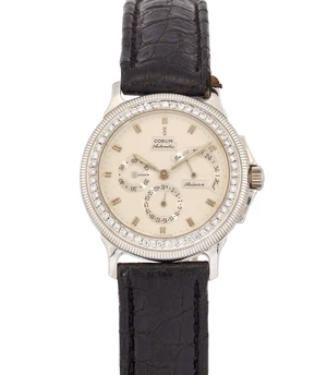 Corum. A platinum and later diamond set automatic calendar wristwatch&nbsp;Reserve de Marche,...