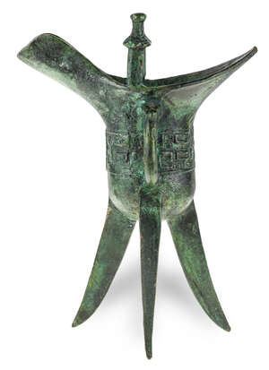 
	
		A Chinese bronze archaistic wine vessel, jue, late 19th century, cast to the body with...