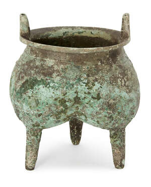 
	
		A Chinese archaic bronze ritual food vessel, li, Shang dynasty, of tri-lobed form, with...