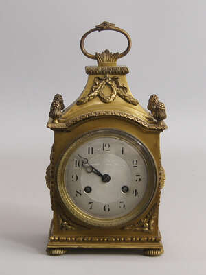 
	
		A French gilt bronze mantel clock, early/mid 20th century, with looping handle and four...