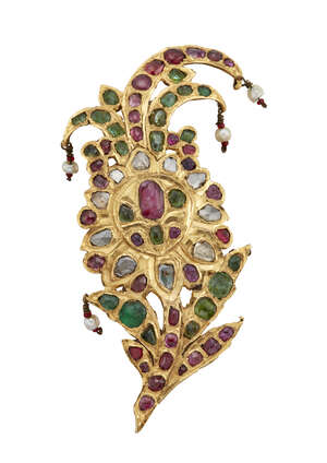 An Indian diamond and gem brooch, of spray from set throughout with foiled vari-shaped and cut emeralds and rubies and rose and flat-cut diamonds, with seed pe
