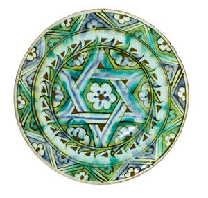 
	
		An Iznik pottery plate, Turkey, 17th century, with wide sloping rim and slightly raised...