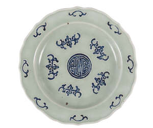 A Chinese 'wufu' dish
Late 19th century
Painted with underglaze blue with five bats on a celadon...