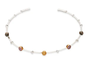 A diamond and coloured diamond torque collar necklace, set with yellow, brown, and pink diamond...