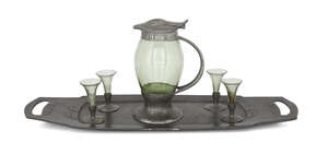 
	
		Liberty & Co., a pewter and green glass liqueur set
		c.1905, stamped English Pewter...