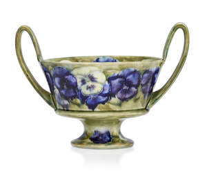 
	
		William Moorcroft (1872-1945), a Pansy pattern twin-handled bowl 
		c.1915, signed in...