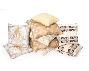 A group of nine cushions by Robert Kime Ltd., comprising: two pairs of modern printed cotton cushions, one with a vase of flower design, 45 x 45cm; a pair of s