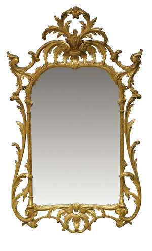 
	
		A Chippendale style carved giltwood upright mirror, the frame surmounted by cusped...