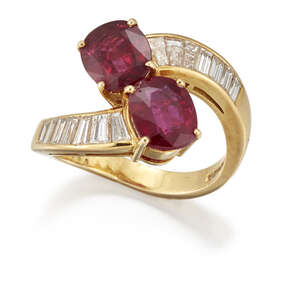 
	
		A ruby and diamond ring, crossover design, set with two oval mixed-cut rubies, the...