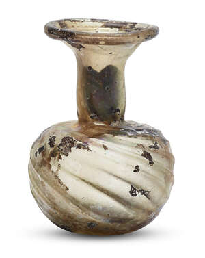 
	
		A Roman yellowish glass sprinkler flask, Eastern Mediterranean, 3rd-4th century A.D., the...