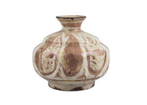 
	
		A Safavid pottery vase, Iran, 17th century, on a short straight foot, of squat...