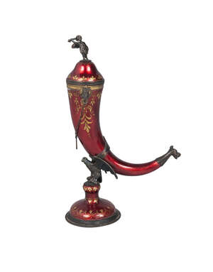 
	
		A silver, part gilt and enamel cornucopia, with gilded decoration, cherub finial to fixed...