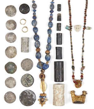 
	
		A restrung Western Asiatic necklace composed of agate and carnelian beads with two...