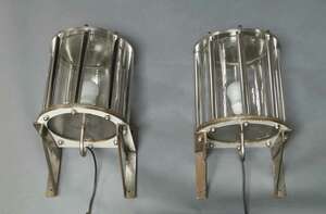 
	
		A pair of chromed metal industrial wall lights, c.1940s-50s, of cylindrical form, with...