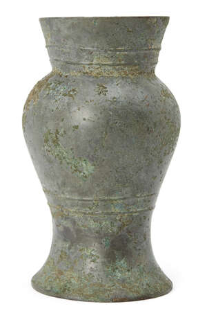 
	
		A Chinese bronze vessel, hu, Shang dynasty, with flared rim and bulbous body to spreading...