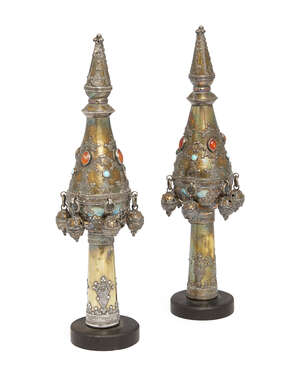 
	
		A pair of East European brass Torah scroll finials, 19th century, applied with carnelian...