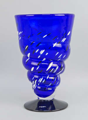 
	
		 Ann Wahlstrom for Costa Boda, a blue glass vase with black and white splash to the...