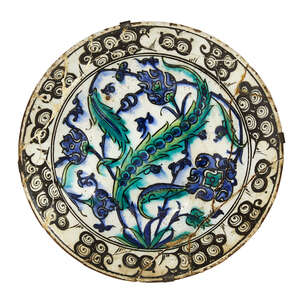 
	
		An Iznik pottery dish, Turkey, circa 1600, of deep form with sloping rim, underglaze...