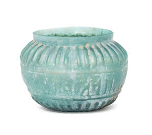 
	
		A turquoise glass bowl with moulded Kufic inscription, Iran, 12th century, with rounded...
