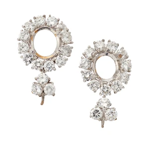 Two diamond set clusters with vacant principal collet,&nbsp;both designed as a vacant oval-shaped...