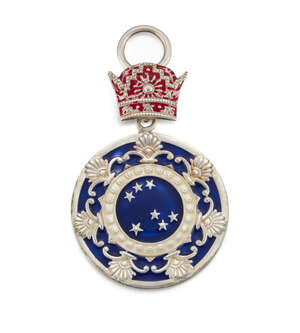 
	
		A white metal medal, Iran, 20th century, of disc form coloured in blue and white, topped...