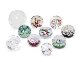 
	
		John Deacons (1950-), a floral paperweight, c.1997, initialled and dated inside base,...