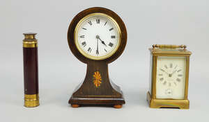 
	
		A French brass cased carriage clock by John Hall and Co., Manchester,  the white enamel...