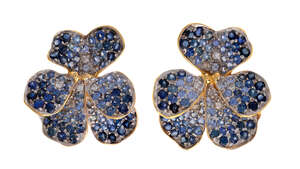 
	
		A pair of sapphire ear clips, by Vevey, each designed as a Violet, pave-set with...