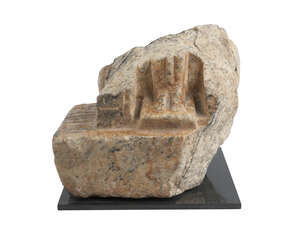 An Egyptian fragment from a naophorus statue New Kingdom, 18th-20th Dynasty, 1540-1069 BC, mounted on a square plinth, depicting the feet, 15 x 17 x 17cm. high