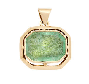 
	
		An inscribed emerald in a later European gold mount, Iran or India, 19th century, faceted...