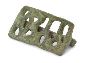 A Byzantine bronze bread stamp, circa 4th-7th century,  of rectangular form, with a Greek inscription in relief, with a ring handle at the back, 4.7cm. long
	