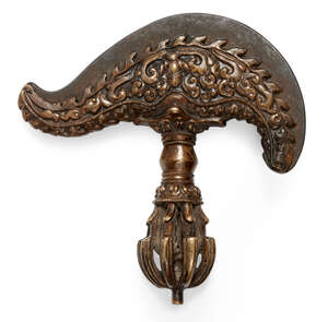 
	
		A Tibetan bronze kartika, late 19th century, with pierced knop above flame motifs mounted...