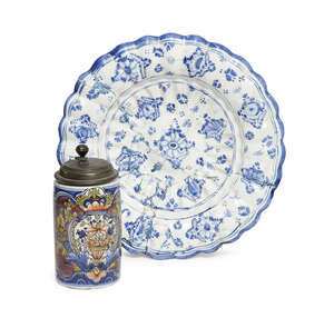 
	
		A German tin glazed earthenware tankard, mid-18th century, with a pewter lid, the body...