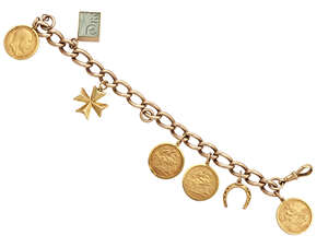 
	
		A 9ct gold charm bracelet, suspending four pendant-mounted half sovereigns and three...