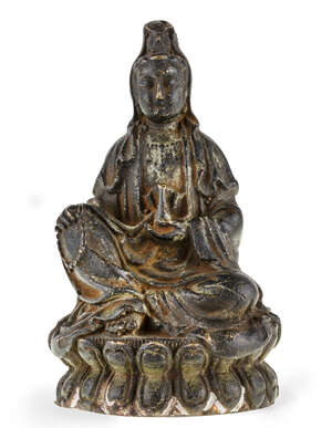 
	
		A Chinese bronze figure of Guanyin, late Ming dynasty, 17th century, cast seated wearing...