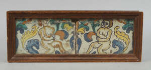 
	
		Two Italian faience tiles, 18th century, the tiles decorated with cherubs within foliage,...
