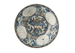 
	
		A late Safavid blue and black bowl with fish, Iran, 18th century, on a short foot, the...