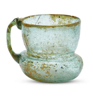 
	
		A bluish-green glass cup, Iran, 9th-10th century, the wide flaring mouth with a rounded...