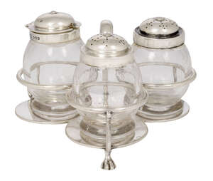 
	
		A trefoil silver-topped glass cruet set, Sheffield, c.1917, The Goldsmiths & Silversmiths...