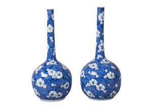 A pair of Chinese porcelain bottle vases, late 19th/early 20th century, painted in underglaze blue with prunus blossom on a 'cracked ice' ground, unmar
